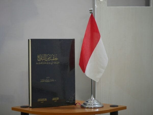 a flag and a book on a table