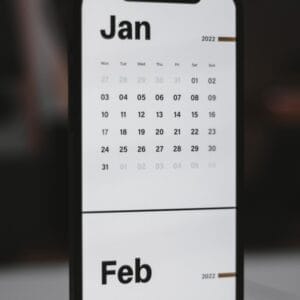 a white and black calendar phone case sitting on top of a table