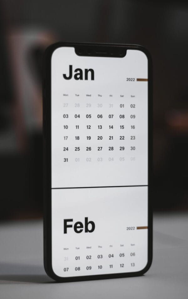 a white and black calendar phone case sitting on top of a table